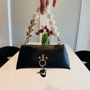 Elegant Black Handbag with Pearl Handle